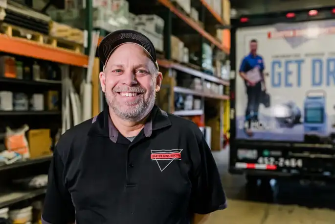 Portrait of Darren Smith in the Baxter warehouse